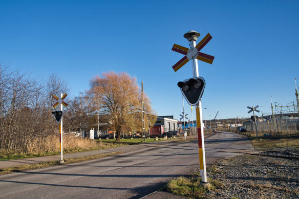 istock Blue sky and railroad crossing in Scandinavia 1356242339