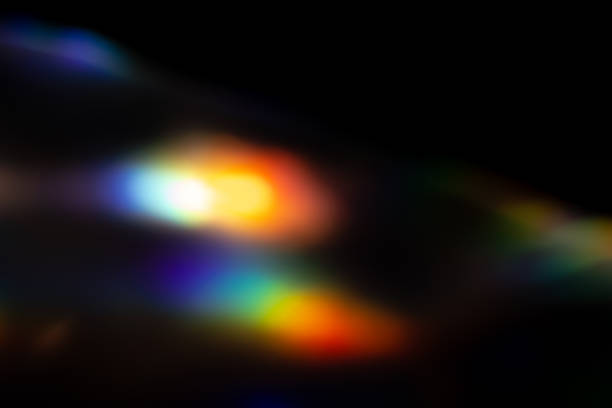 istock colorful rainbow crystal light leaks on black background 1356243153