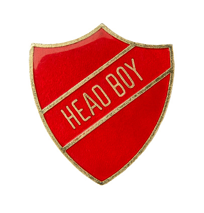 An Isolated Shield Shaped Badge For Head Boy From A British School On A White Background