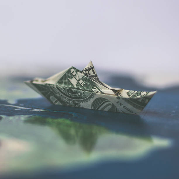 istock Money Origami Naval SHIP Folded with Real 1 Dollars Bill 1356246404