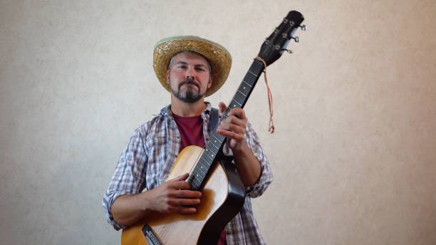 istock The musician plays the guitar intensively 1356246609