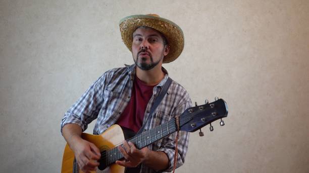 istock A man sings and plays the guitar 1356246610