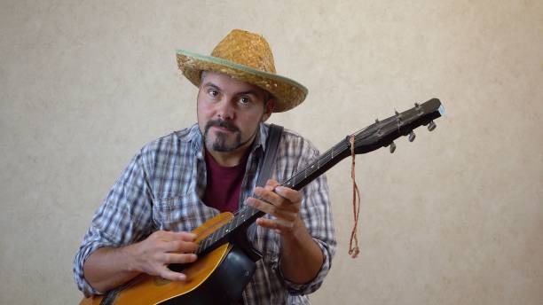 istock A man playing the guitar gambling 1356246626