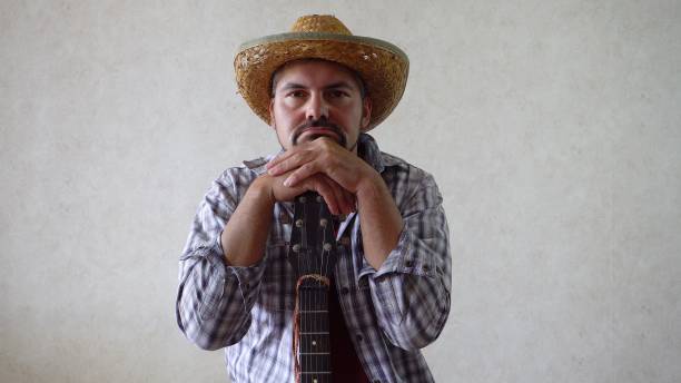 istock Man folded his hands on the guitar 1356246668
