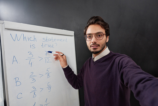 Mixed race teacher explaining new material