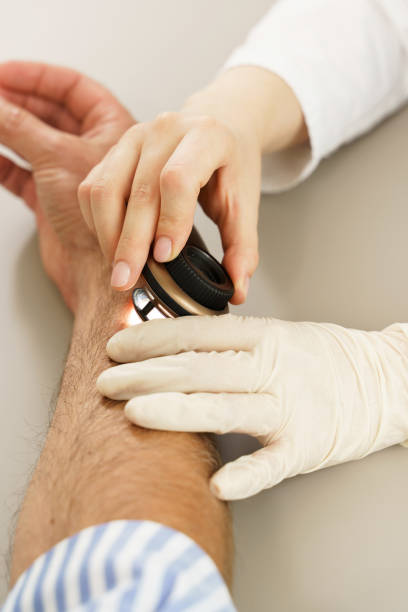 istock Dermatologist is using dermatoscope for skin examination. 1356247862