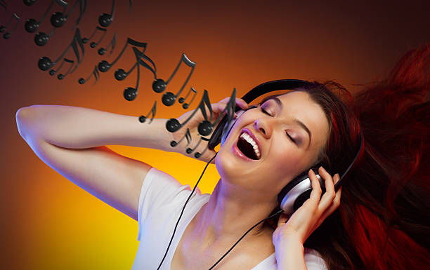 istock girl with headphones 135625043