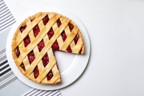 Delicious fresh cherry pie on white table, top view. Space for text Delicious fresh cherry pie on white table, top view. Space for text crostata photos stock pictures, royalty-free photos & images