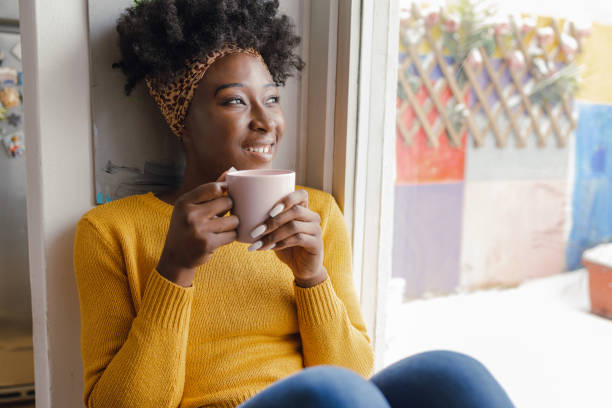 istock Enjoying the morning coffee by the window 1356252177
