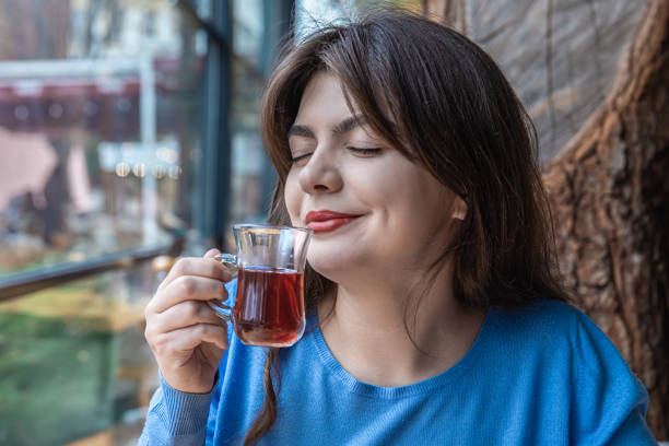 istock A young woman in a cafe drinks Turkish tea. 1356252309