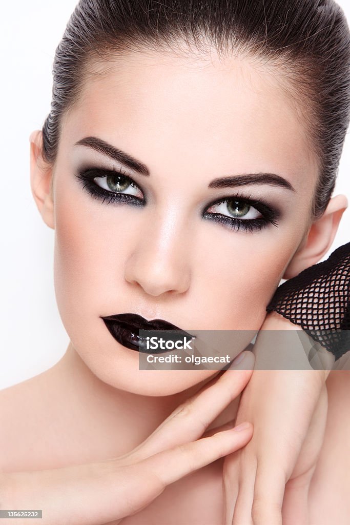 Gothic glamour Close-up portrait of young beautiful woman wiith stylish black make-up Adult Stock Photo