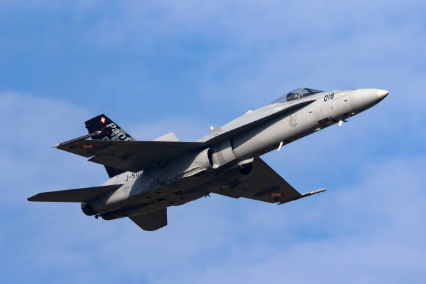 Swiss Air Force McDonnell Douglas F/A-18C multirole fighter aircraft departing Payerne Airport. Payerne, Switzerland - September 7, 2014: Swiss Air Force McDonnell Douglas F/A-18C Hornet multirole fighter aircraft departing Payerne Airport. fa 18 hornet stock pictures, royalty-free photos & images