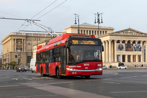 Budapest, Hungary - 17th November, 2021: Low-floor trolleybus Solaris Trollino 12 driving on a street. The Trollino is one of the most popular trolleybuses in Europe.