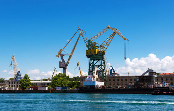 istock Cargo crane, freight traine and coal in port 1356257005