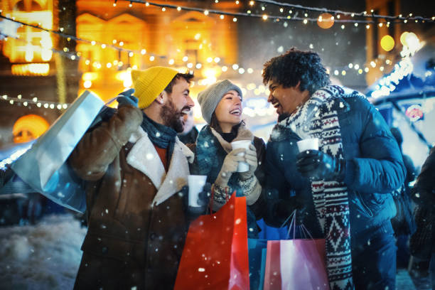istock Friends taking a break during Christmas eve shopping. 1356262079