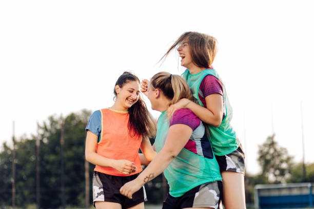 istock Girls in a rugby team cheering for the point 1356263169