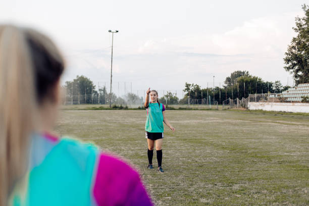 istock Girls training rugby on the field 1356263186