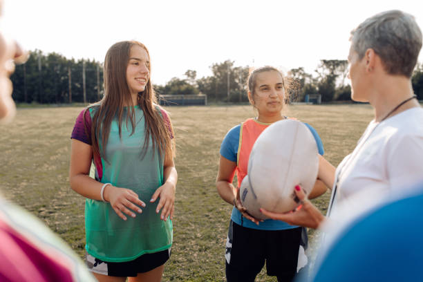 istock Coach preparing her female team for a rugby game 1356263286