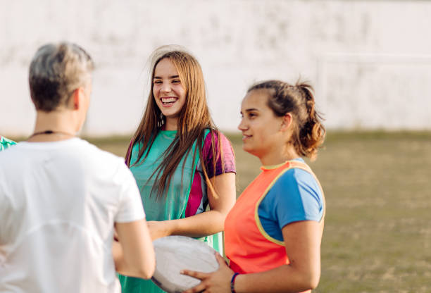 istock Coach preparing her female team for a rugby game 1356263338