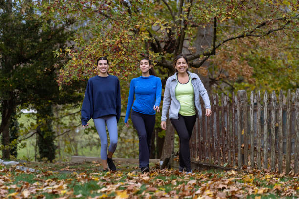 istock Family exercising outdoors 1356263426