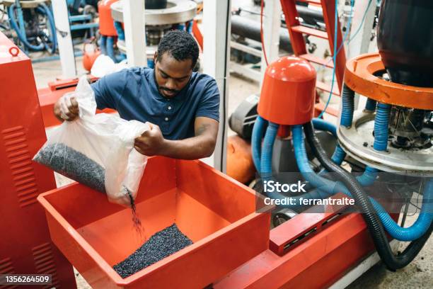 Blue Collar Working In Plastic Recycling Factory Stock Photo - Download Image Now - Plastic, Recycling, Manufacturing