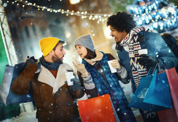 istock Friends taking a break during Christmas eve shopping. 1356266374