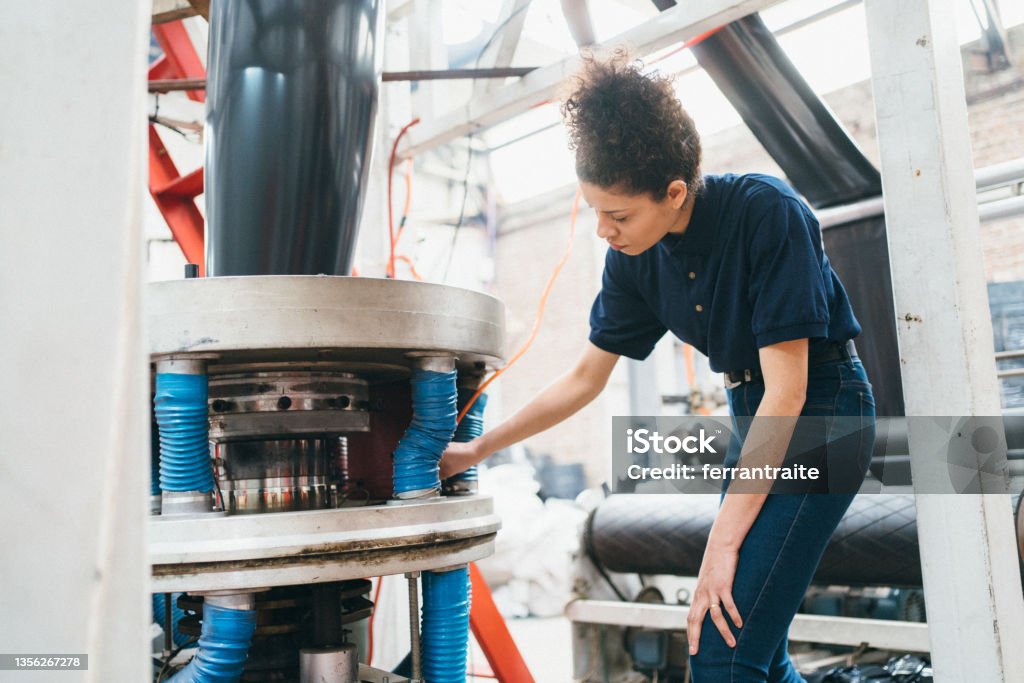 Engineer working in plastic recycling factory Recycling Stock Photo