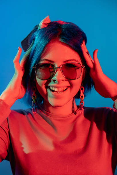 istock woman neon portrait positive expression night 1356272233