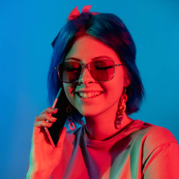 istock phone conversation modern gadget woman neon light 1356272246