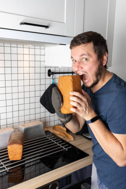 The process of making homemade rye bread, a man wants to try a loaf of bread funny.