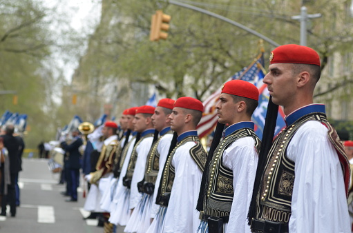 Costumed participants march up Fifth Avenue, New York City in the annual Greek Independence Day Parade on April 14, 2019.