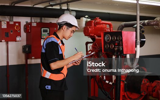 istock Young engineer check fire suppression system in control room of factory , daily check job of maintenance technician 1356275037