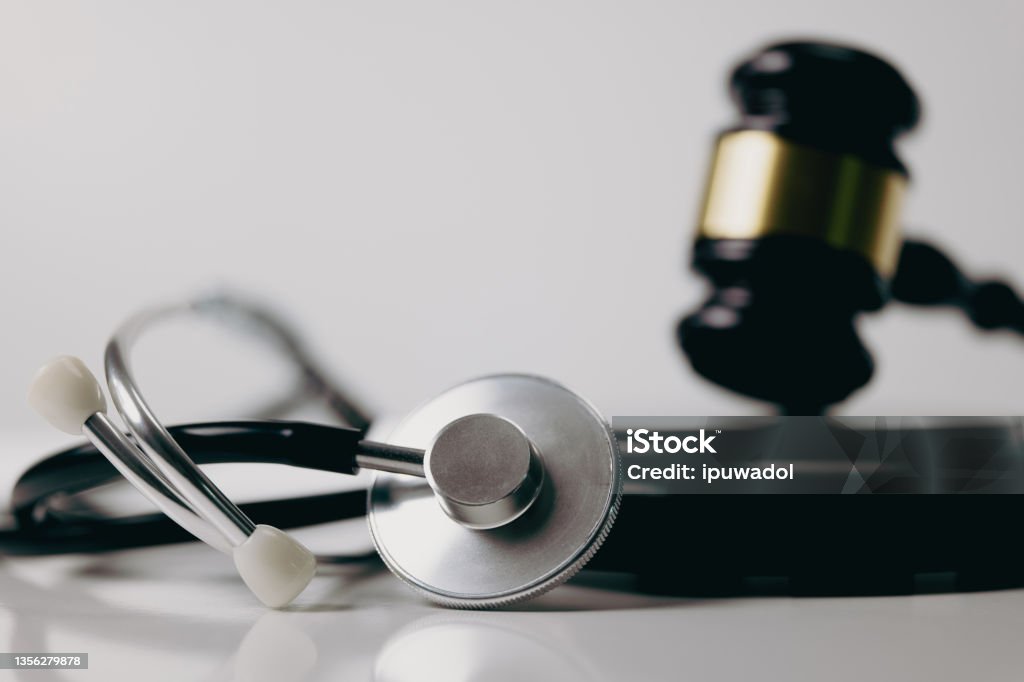 Stethoscope and gavel on white background, symbol of law and medic Healthcare And Medicine Stock Photo