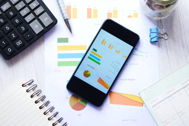 istock top view of financial chart display on smart phone on table 1356281807