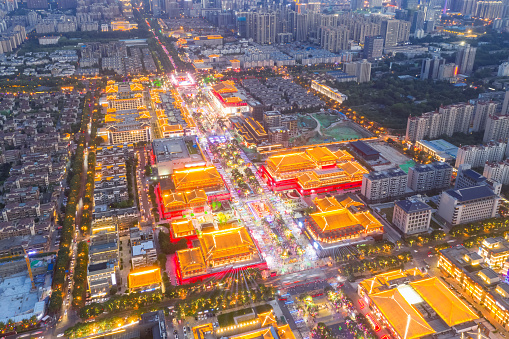 aerial view of the sleepless town in xian, the tang dynasty style building was ablaze with lights on night market, Shaanxi, China.