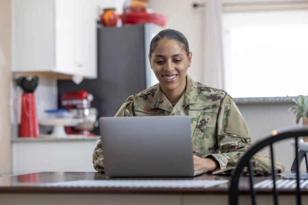 Air Force Service Member at home A female Air Force Service Member at home air force stock pictures, royalty-free photos & images