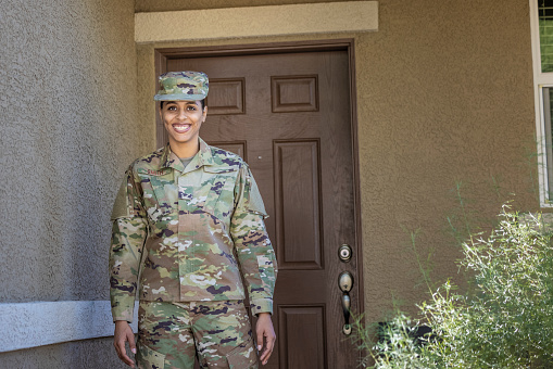 A female Air Force Service Member at home