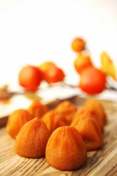 istock Half-dried dried persimmons and ripe persimmons 1356294308