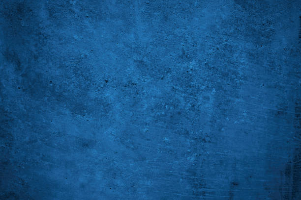 istock Navy blue rough background. Toned texture. Old scratched damaged wall surface. Blue concrete background 1356296039