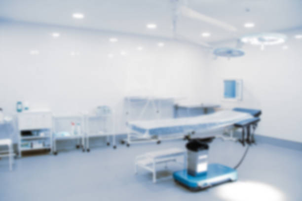 istock Blurry empty interior operating room and modern equipment in hospital.Medical device for surgeon surgical emergency patient in blue tone style.Save life medical treatment concept 1356296490