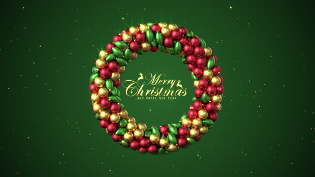 Christmas wreath being made with baubles and ornaments revealing Merry Christmas in green