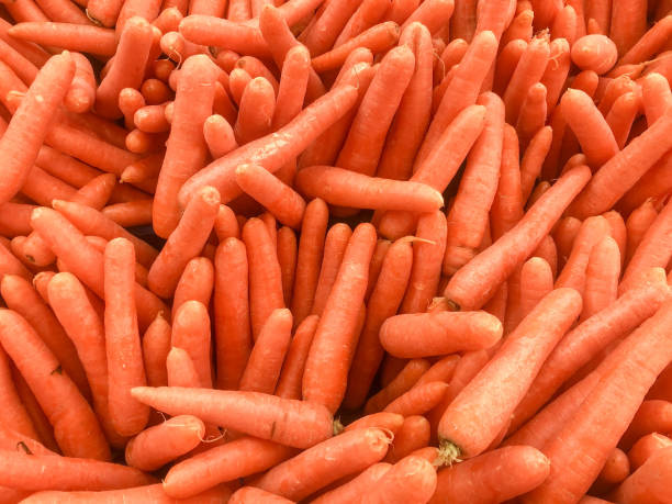 istock heap of ripe carrots as a background 1356306991