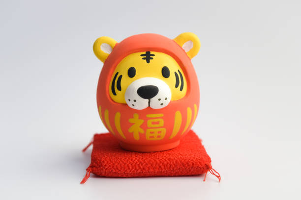Tiger Daruma for New Year's cards A tiger disguised as a traditional Japanese Daruma doll. zabuton stock pictures, royalty-free photos & images
