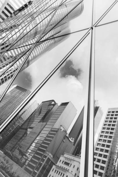 istock Reflection of urban skyline on modern office building 1356308325