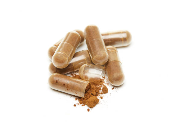 istock Herb capsule, Nutritional Supplement, Vitamin Pill, Herbal Medicine on white background 1356309633