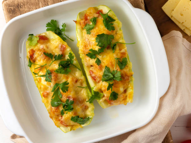 istock Baked zucchini stuffed with tomatoes, mushrooms and cheese 1356312374
