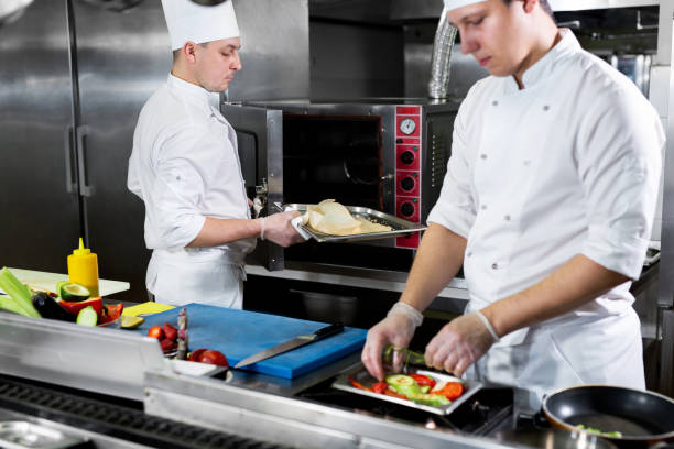 istock Chefs prepare meals in the kitchen 1356314693