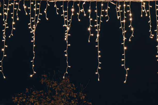 A string of lights at night stock photo