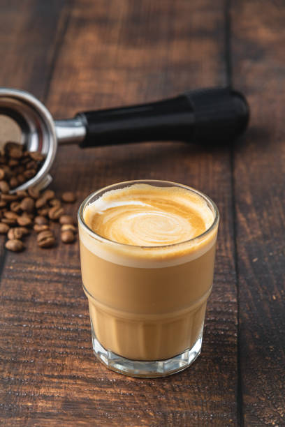 istock Cortado coffee with coffee beans next to it. Traditional coffee in Spain. 1356319093