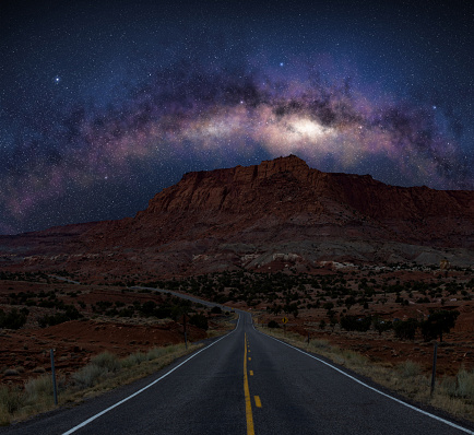 The Milky Way galaxy over a desert road in sothwest US.